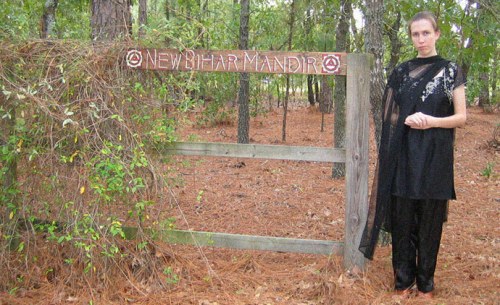 Jillian Hoy, wife of white power leader, pro North Korea advocate, and Jim Jones supporter Joshua Caleb Sutter. Here Hoy, who bills herself a Hindu priestess Jayalalita Devi Dasi, is pictured at the rural South Carolina property where the Hindu temple New Bihar Mandir is located which worships the deity Kali, the “Goddess of Destruction” is located