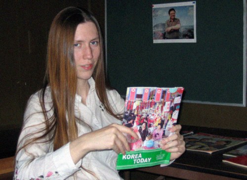 Jillian Hoy—or “comrade Morrison” of the pro North Korean Rural people’s party holding a Korean trade magazine sent to them by the Pyongyang government in 2008. The photo is from inside the mobile home in rural South Carolina that served as headquarters for the RPP.