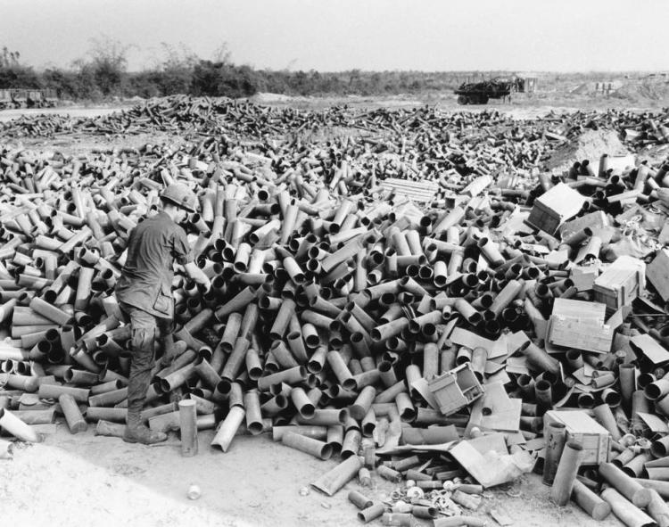 Empty artillery cartridges pile up at the artillery base at Soui Da, some 60 miles northwest of Saigon, at the southern edge of War Zone C, on March 8, 1967. (AP Photo/Horst Faas)